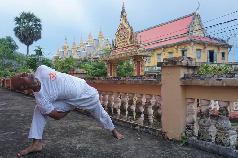 Yoga Studio Hoi An - Aum Yoga Vietnam: Rahul practicing yoga at a pagoda in Hoi An